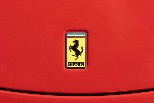 BARCELONA, SPAIN-MAY 8, 2021: Ferrari logo Cavallino Rampante ("prancing horse") on the bonnet of real car