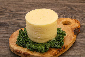 Yellow round dairy soft cheese