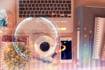 Double exposure of map hologram drawing over desktop. Top view. International connection concept.