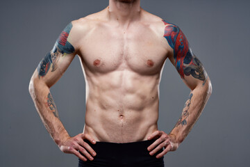 Fototapeta na wymiar pumped up press tattoo on arm cropped view of workout fitness