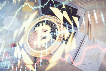 Double exposure of man's hands typing over computer keyboard and crypto currency theme hologram drawing. Top view. Blockchain concept.