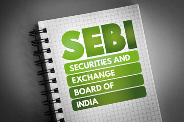 SEBI - Securities and Exchange Board of India acronym on notepad, business concept background - obrazy, fototapety, plakaty