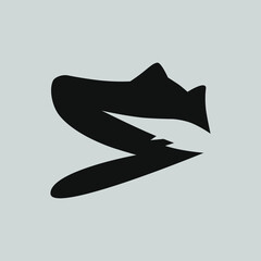 Sports running shoe symbol on gray backdrop. Design element