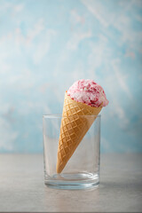 Close up of berry gelato scoop in waffle cone