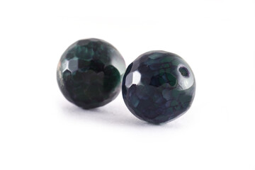 Patterned Green agate beads isolated on white,Round Agate beads,Semi Precious stones. Natural mineral beads. Beads made of natural stones to create jewelry.