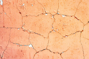 Texture of a concrete wall with cracks and scratches which can be used as a background