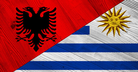 Flag of Albania and Paraguay on wooden planks