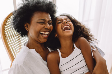 Cheerful grandmother and granddaughter