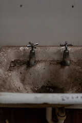 old dirty and rusty sinks in disused warehouse on Cockatoo Island