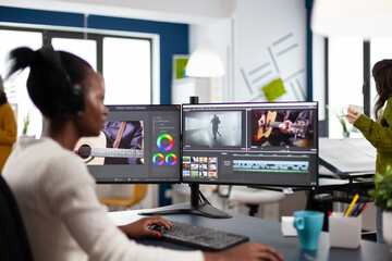 African video editor working with footage and sound, editing new project cutting film montage...