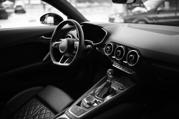 Sporty interior of a modern, luxurious car. Close up. Leather seats, futuristi design