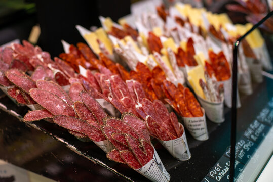 Barcelona Spain March 25 2019: Traditional Spanish meat snacks, for sale in the La Boqueria market in Barcelona, Spain.