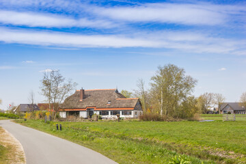 Fototapeta na wymiar Old farm on the Burd island in Friesland, Netherlands