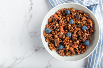 Chocolate granola, muesli with almonds, hazelnuts and blueberries