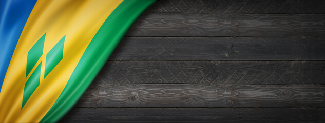 Saint Vincent and the Grenadines flag on black wood wall banner