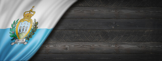San Marino flag on black wood wall banner
