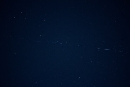 Starlink satellites passing by in the night sky