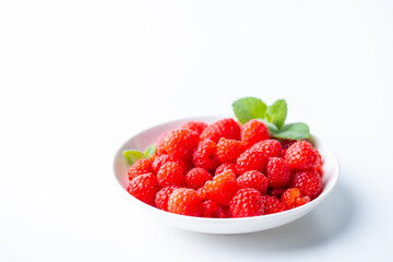 Fresh raspberries in a plate.