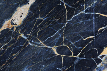 Gold, yellow and white patterned natural structure of dark gray blue marble texture background.