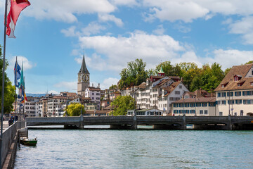 Houses with tiled roofs on the banks of the Limmat River. Zurich, Switzerland