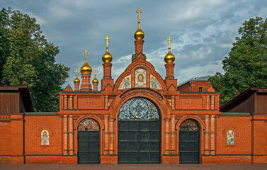 View to the entrance gate of Alekseevsry monastery in Moscow. Established in 1360
