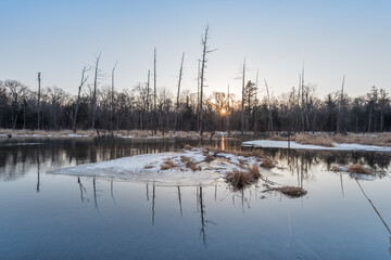 Snow and trees and rivers under the setting sun in Changbai Mountain, Jilin, China in winter 