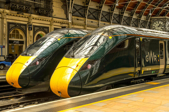 London, England - June 2018: High speed trains side by side at London Paddington railway station. The train service is operated by Great Western Railway