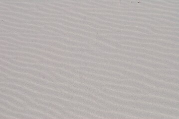 Waves in white sand, no footsteps