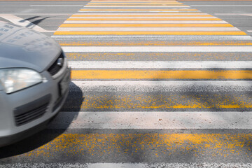 Pedestrian crossing and car hood in motion. Traffic violation concept, unsafe driving, risk