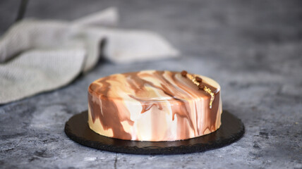 Delicious coffee mousse cake with mirror glaze. Modern dessert.