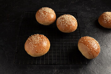 ready-made burger buns on a wooden cutting board. Home cooking