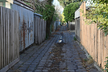 A bluestone laneway in metropolitan Melbourne, on a sunny autumn day