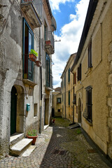 Nusco, Italy, May 8, 2021. A small street among the picturesque houses of a medieval village in the...