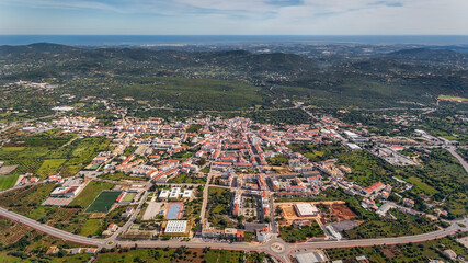 Aerial view from the sky of the Portuguese village of Sao Bras de Alportel, overlooking the Atlantic Sea. Portugal Algarve