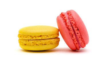 two color macaron cakes, one yellow and one pink on a white background