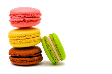 color macaron cakes on a white background