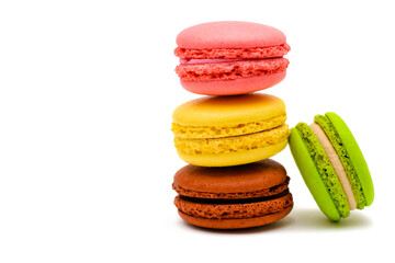 color macaron cakes on a white background