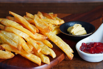 Homemade French fries or potato chips with Mayonnaise and tomato