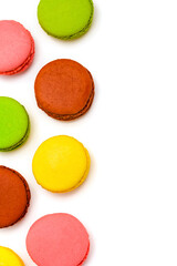 multicolored macaron cakes on a white background