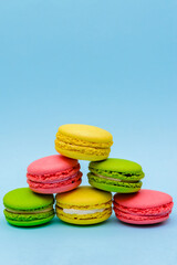 color macaron cakes on a blue background