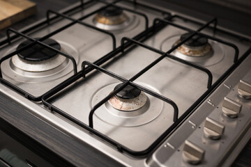 Gas cooker in modern kitchen - cleaning home appliances