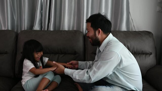 Father day concept,Asian dad and daughter use time together at home