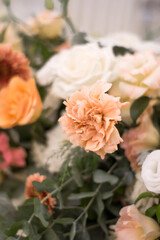 Close up of flower arrangement for wedding main table at a wedding reception.