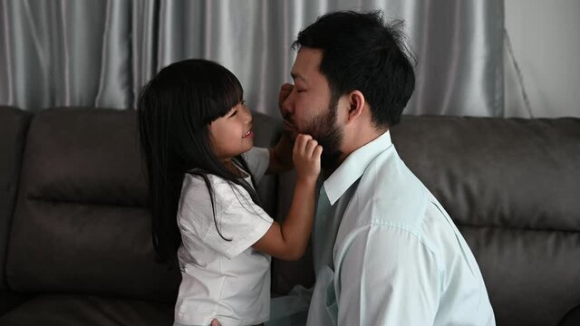 Father day concept,Asian dad and daughter use time together at home