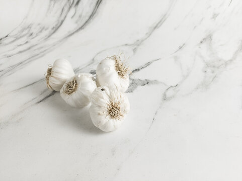 Garlic isolated with marble background 