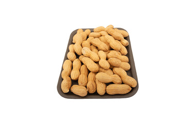 Unpeeled peanuts in a box isolated on white background