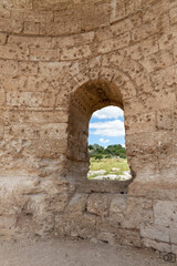 Fototapeta na wymiar The window in the ruins of the Byzantine church of St. Anne near the Maresha city in Beit Guvrin, Kiryat Gat, in Israel
