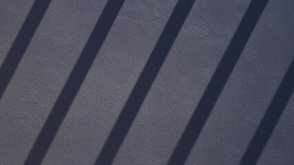 Geometric pattern on the wall formed by light and shadow