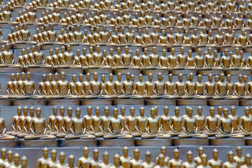 Million golden Buddha figurine in Wat Phra Dhammakaya. Buddhist temple, Bangkok, Thailand