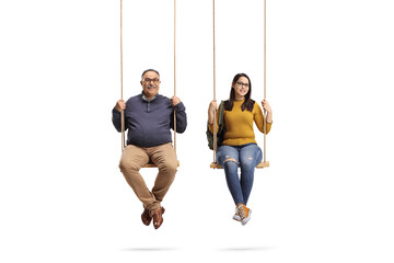 Mature man and  female student sitting on wooden swings